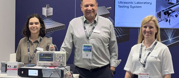 ECNDT 2026 SONOTEC team at exhibition booth